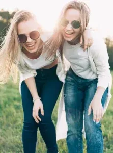 imgi_71_Two-young-women-are-having-fun-on-the-green-field-222x300